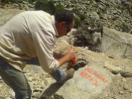 Writing the signature of the voluntary work in Selini, Ikaria